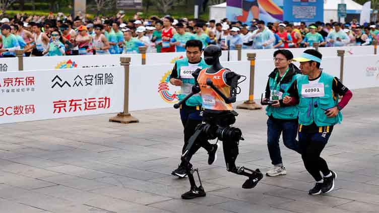 China hosts world's first race between humans and robots
